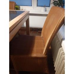 Mooie tafelset van Vincent Sheppard met massief granieten blad en 4 rotanstoelen