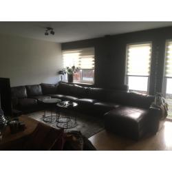 Grote hoeksalon hoekbank bruin leer