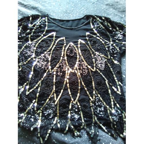 Zeer mooie zwart met zilveren blouse