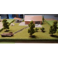 Diorama van een huis met een tuin