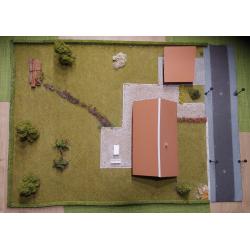 Diorama van een huis met een tuin