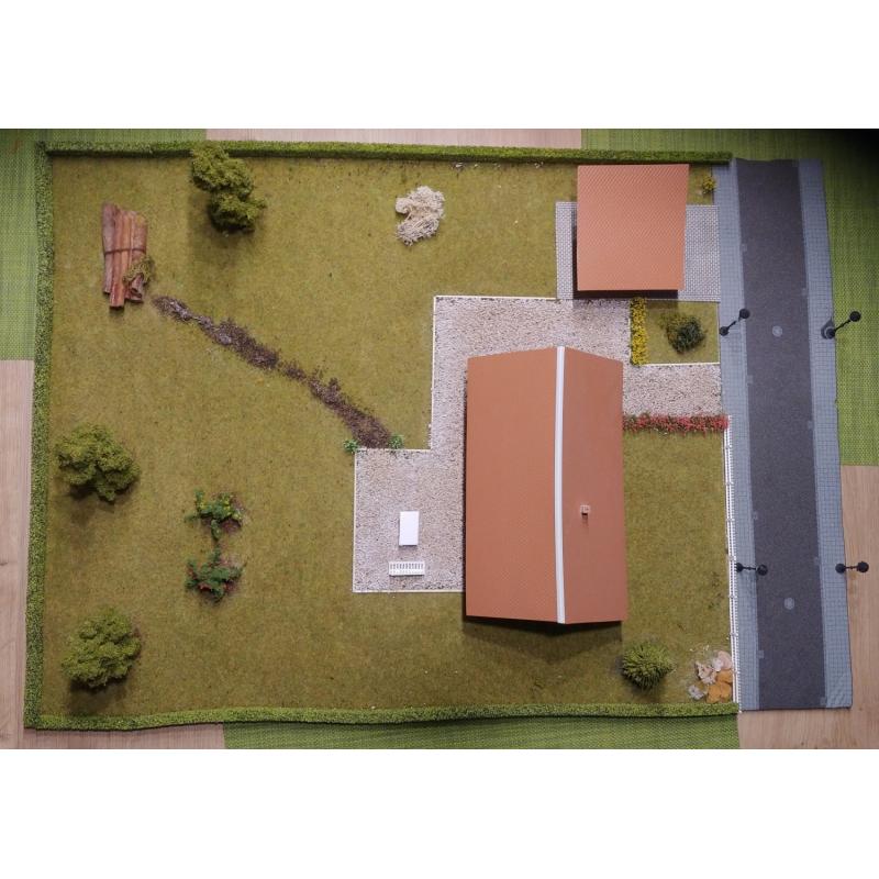 Diorama van een huis met een tuin