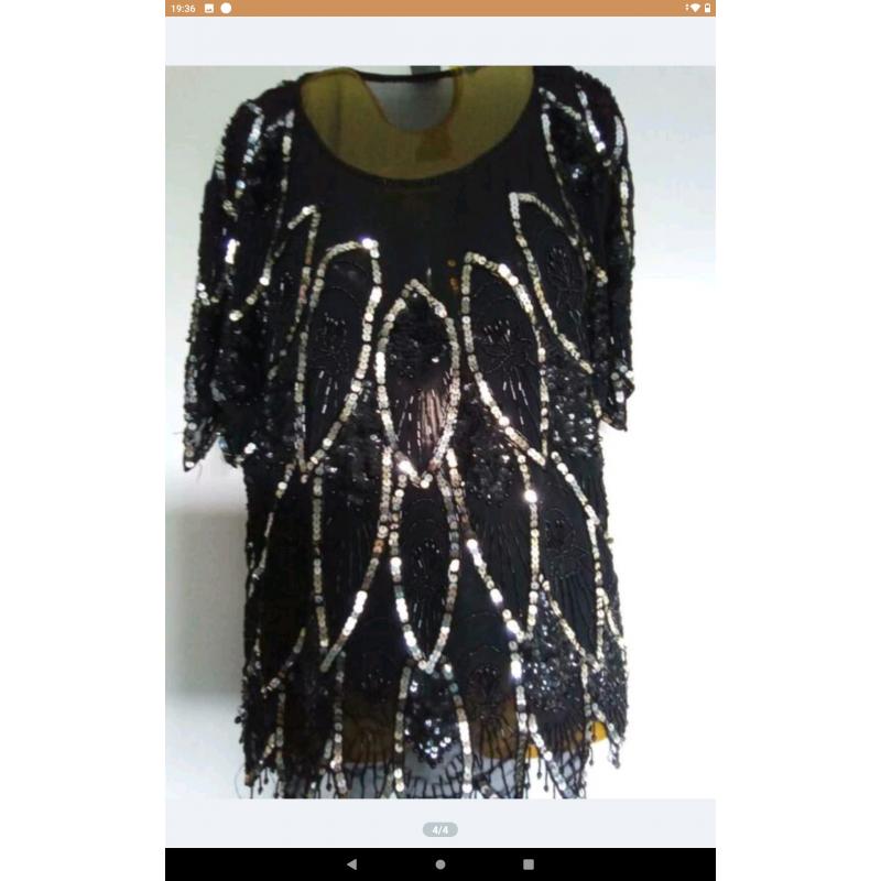 Zeer mooie zwart met zilveren blouse