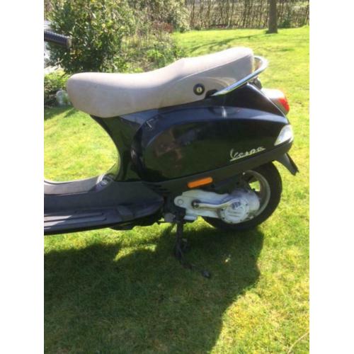 Vespa LX50 met windscherm