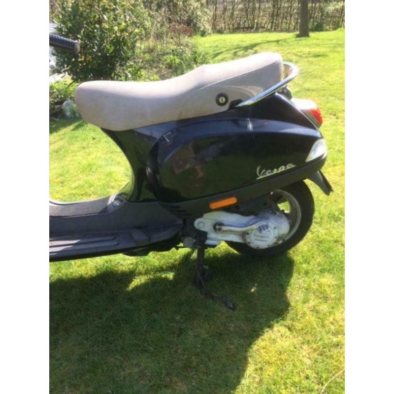Vespa LX50 met windscherm