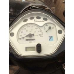 Vespa LX50 met windscherm
