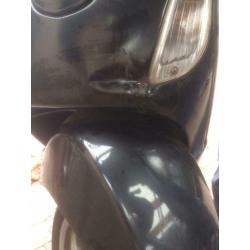 Vespa LX50 met windscherm